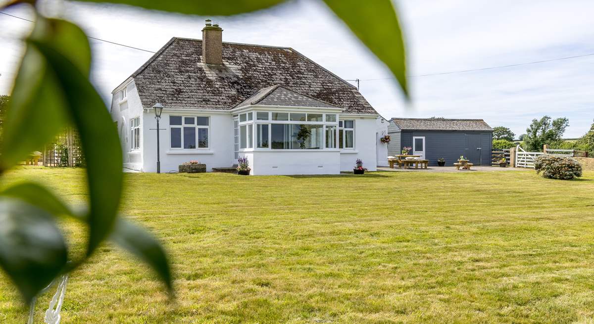 The large front garden will delight everyone, the perfect spot for soaking up the sun and  playing garden games.