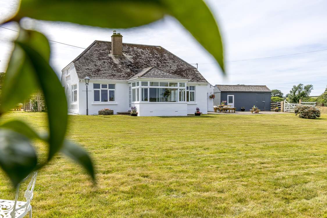 The large front garden will delight everyone, the perfect spot for soaking up the sun and playing garden games.