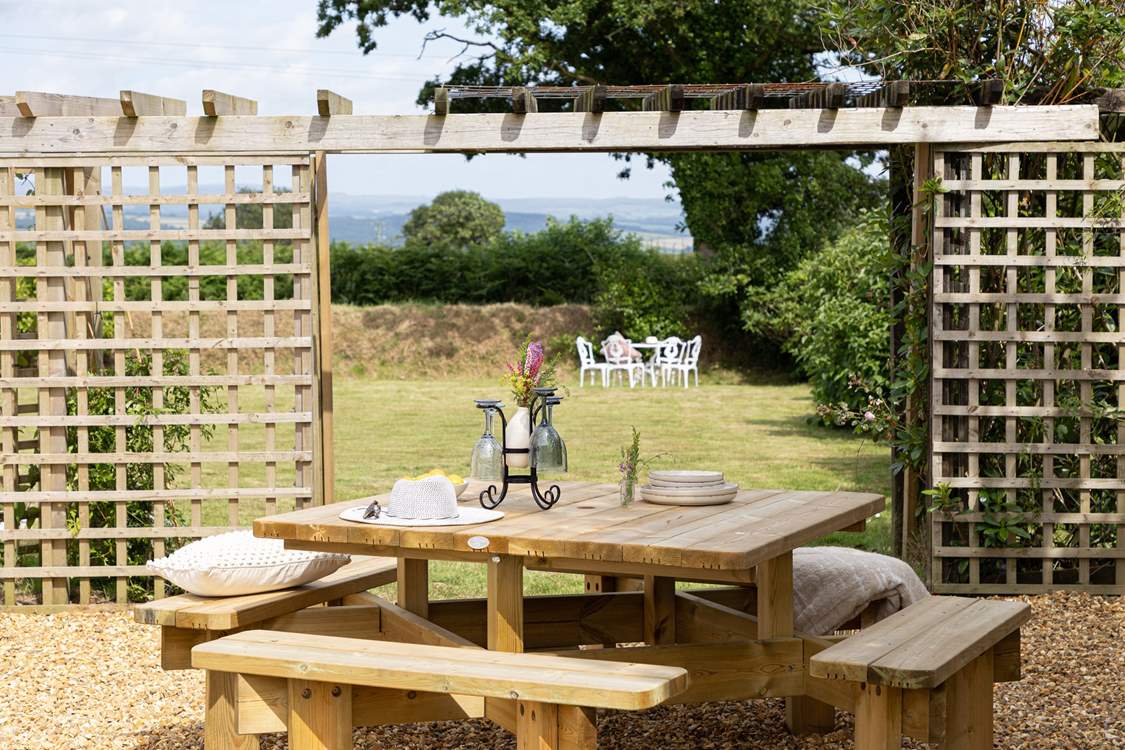 Another table on the side terrace, next to the hot tub.