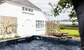 Relax in the bubbling hot tub. - Thumbnail Image