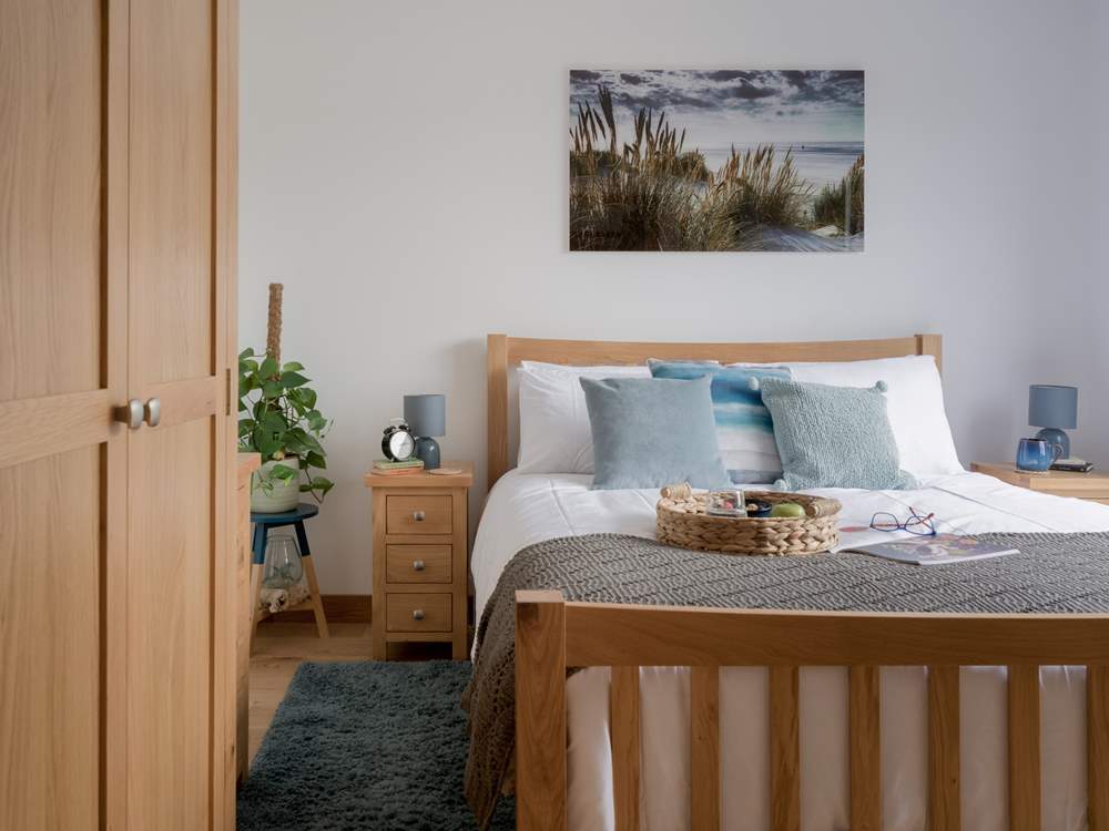 Beautiful bedroom 1 has an en suite bathroom and direct access on to the decking.