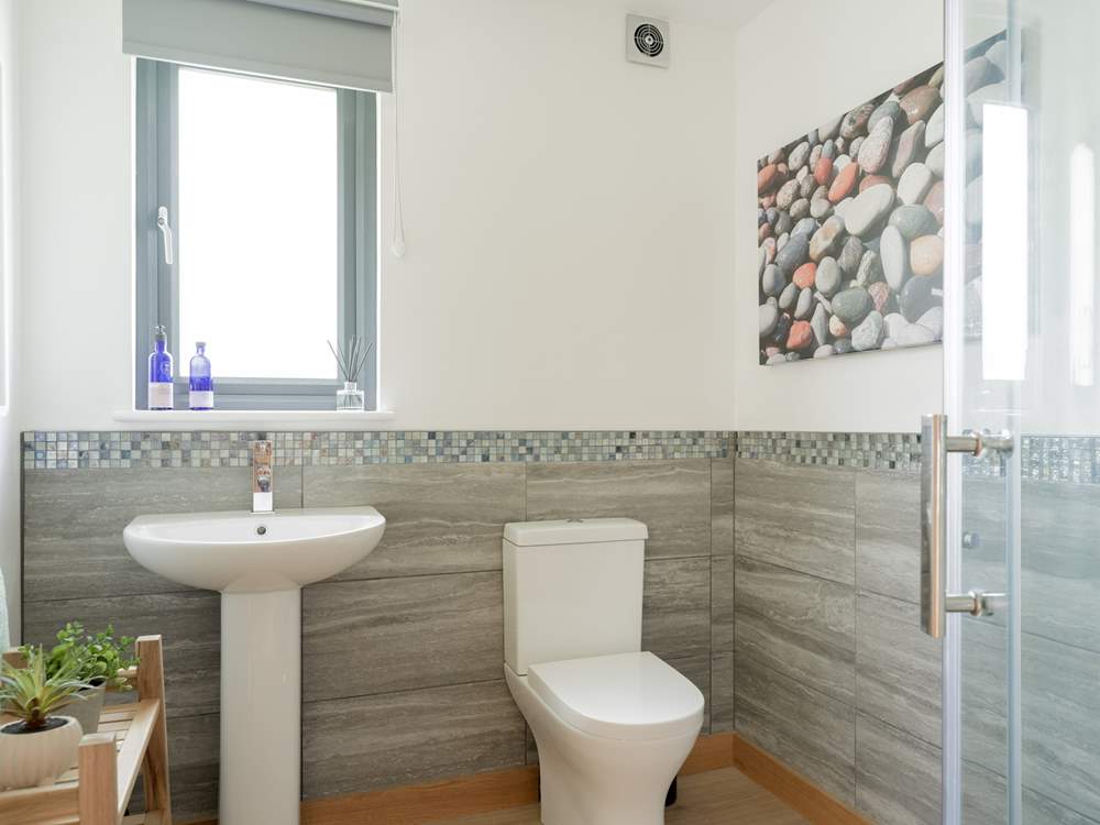 The shower-room is shared between bedrooms 2 and 3.