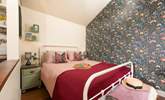 The soothing tones in the bedroom reflect the surrounding countryside.  - Thumbnail Image