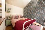 The soothing tones in the bedroom reflect the surrounding countryside. 