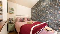 The soothing tones in the bedroom reflect the surrounding countryside. 