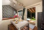 Open the doors and admire the serene rural setting.