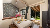 Open the doors and admire the serene rural setting.