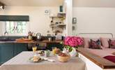 Enjoy leisurely meals in the bright and airy dining space. - Thumbnail Image