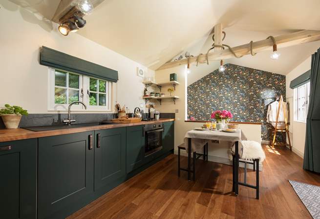 The kitchen is modern and well-equipped. 