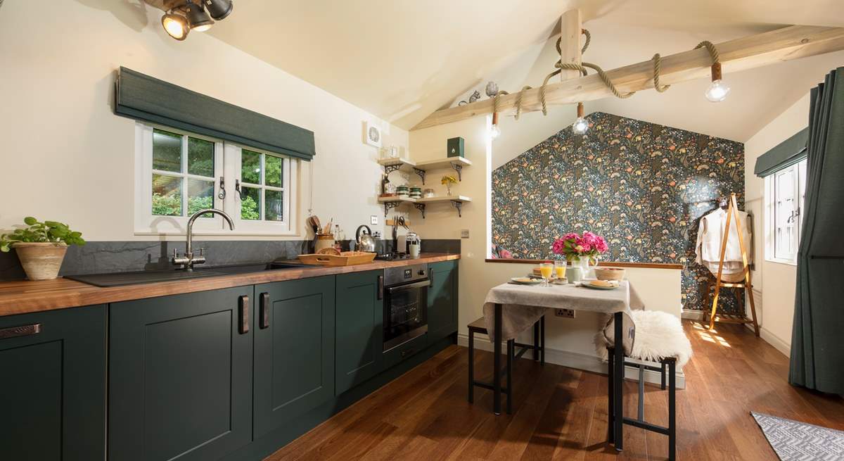 The kitchen is modern and well-equipped. 