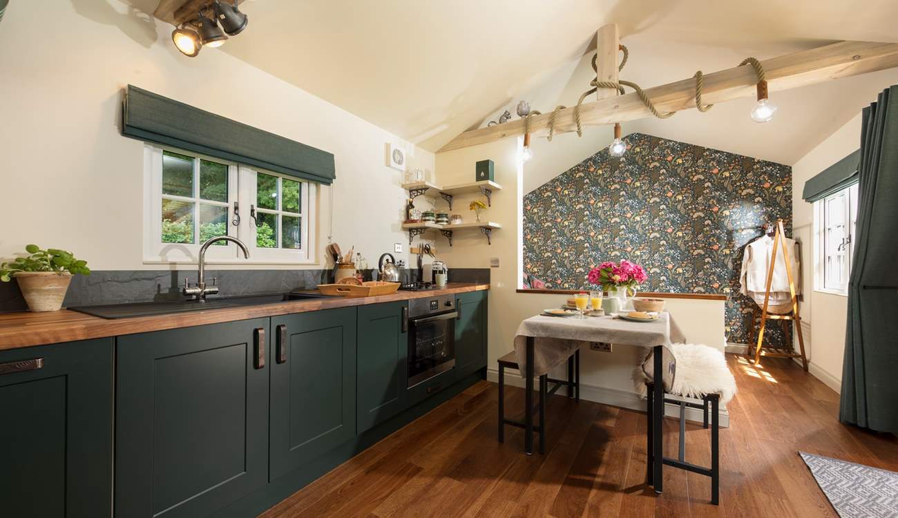 The kitchen is modern and well-equipped. 