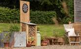 Enjoy warm, sun-dappled evenings with outdoor games. - Thumbnail Image