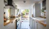 A gorgeous modern kitchen with all 'mod-cons'  leads you to the pretty enclosed garden.. - Thumbnail Image