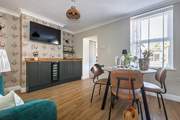 Dining in style with plenty of room to store the fizz in the wine fridge!