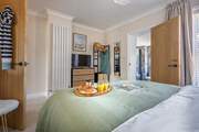 The beautiful main bedroom with luxury en suite.