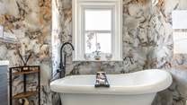 Enjoy a luxurious bath after a busy day exploring this stunning coastline.