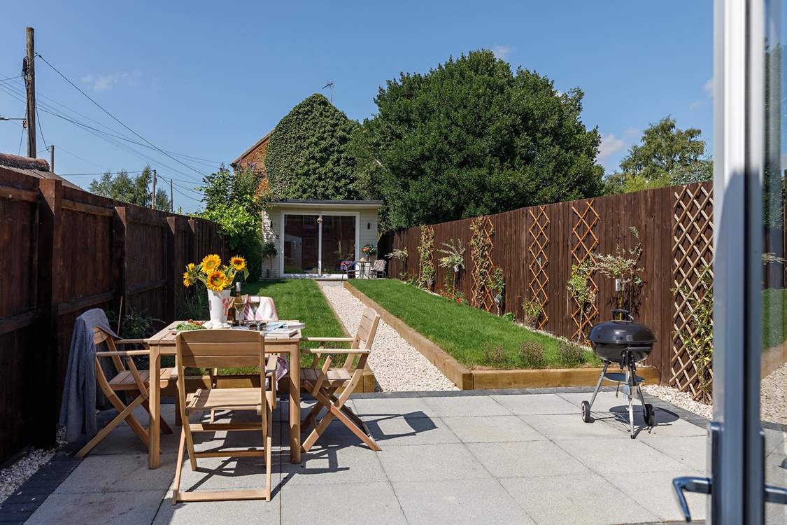 The garden is perfect for al fresco dining, the summer-house is currently not available for guests' use.