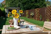 Enjoy the sunshine in the pretty garden.