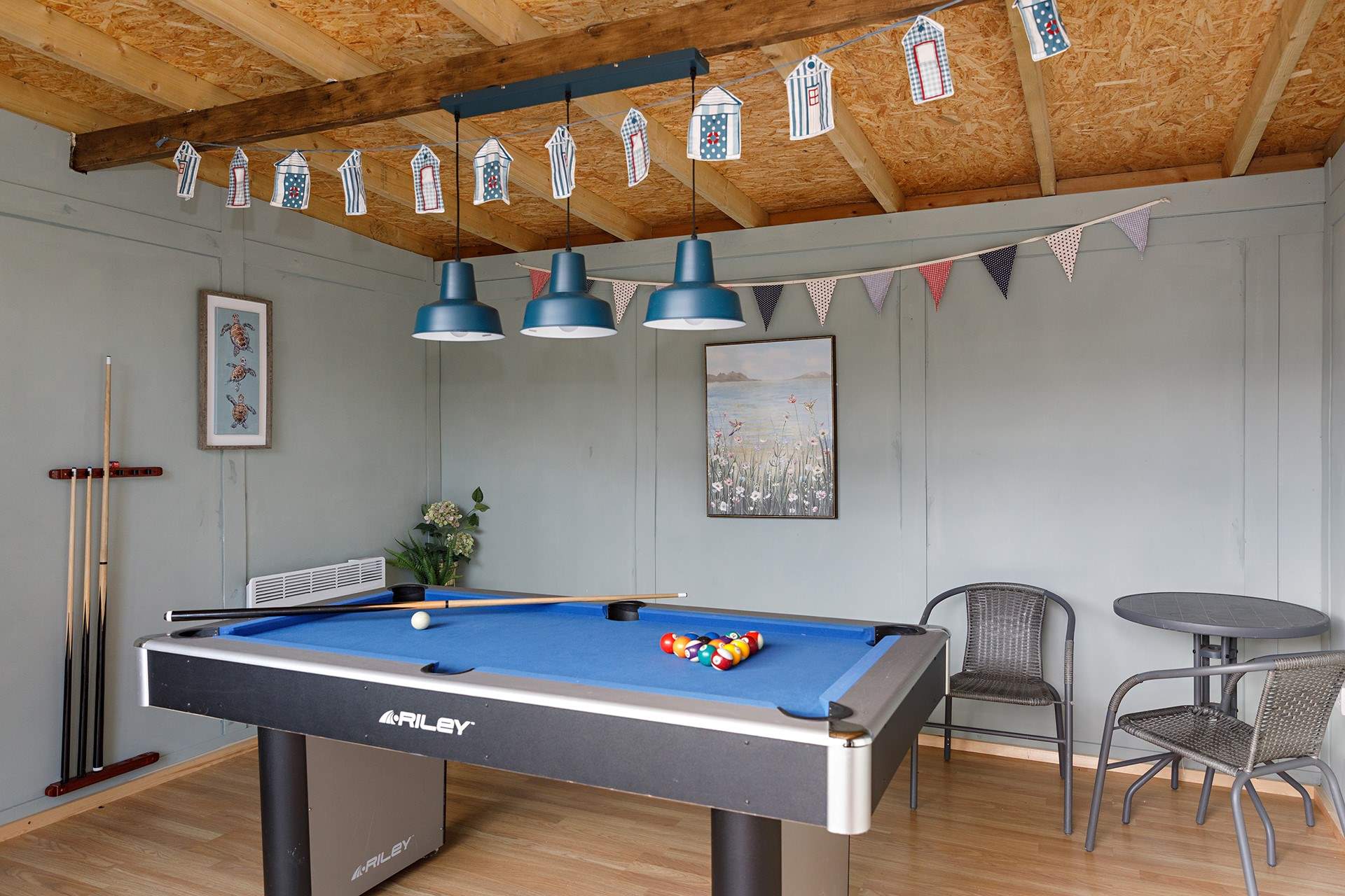 Perfect to enjoy year-round is the fun games room complete with record player!