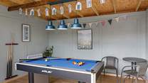 Perfect to enjoy year-round is the fun games room complete with record player!