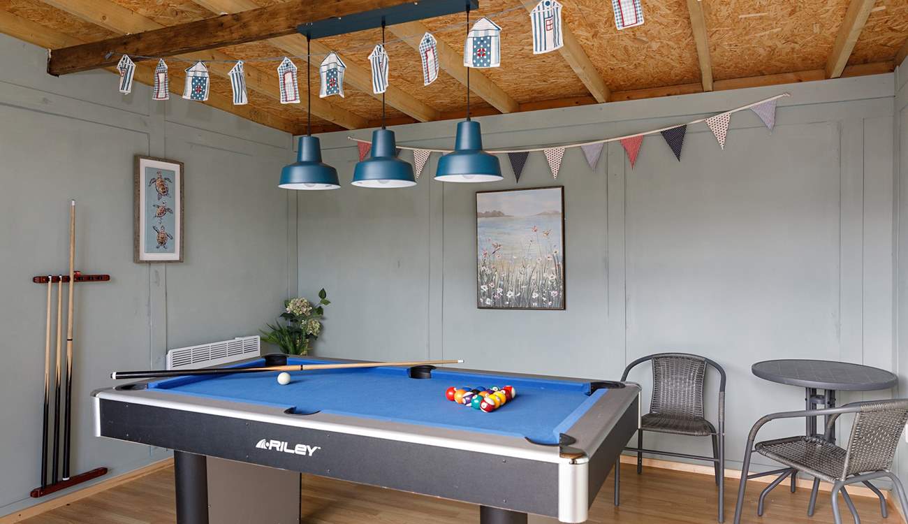 Perfect to enjoy year-round is the fun games room complete with record player!