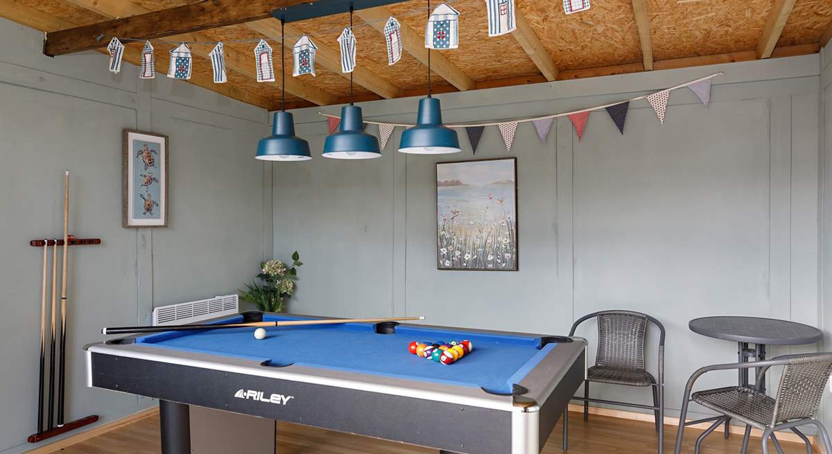 Perfect to enjoy year-round is the fun games room complete with record player!