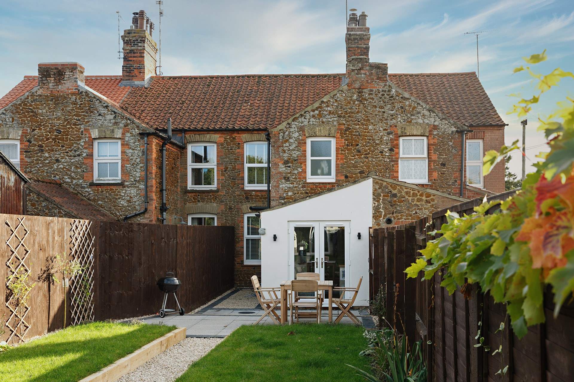 Looking down the garden to the cottage from the games room.