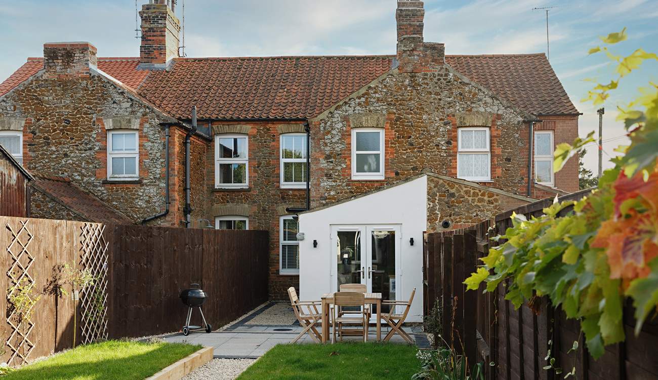 Looking down the garden to the cottage from the games room.