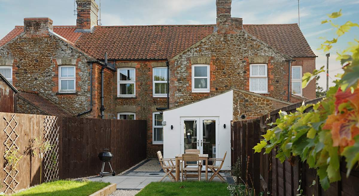 Looking down the garden to the cottage from the games room.