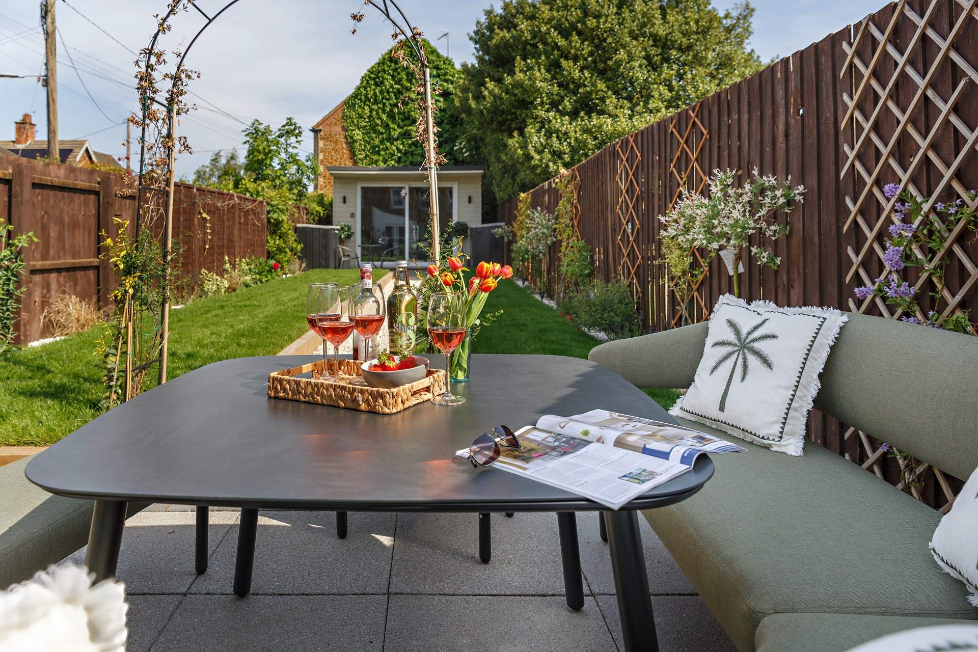 The rear garden complete with grape vine and Summer house/Games room.