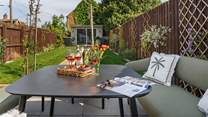 The rear garden complete with grape vine and Summer house/Games room.
