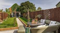 Enjoy the sunshine in the pretty garden.