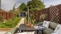 The garden is perfect for al fresco dining. There is a delightful summer-house with 6' 3