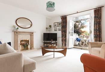 A sitting-room that leads out to the second courtyard via the second set of original double doors.