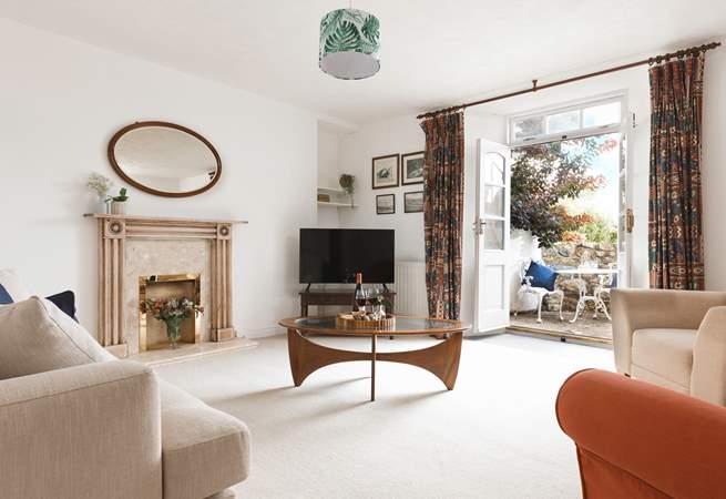 A sitting-room that leads out to the second courtyard via the second set of original double doors.