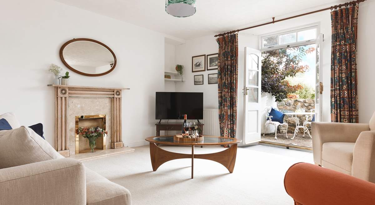 A sitting-room that leads out to the second courtyard via the second set of original double doors.