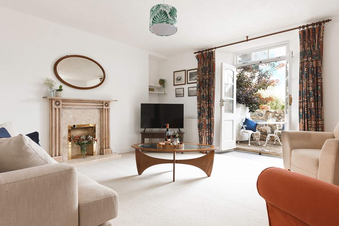 A sitting-room that leads out to the second courtyard via the second set of original double doors.