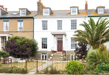 The area of lawn is shared with the apartments above.