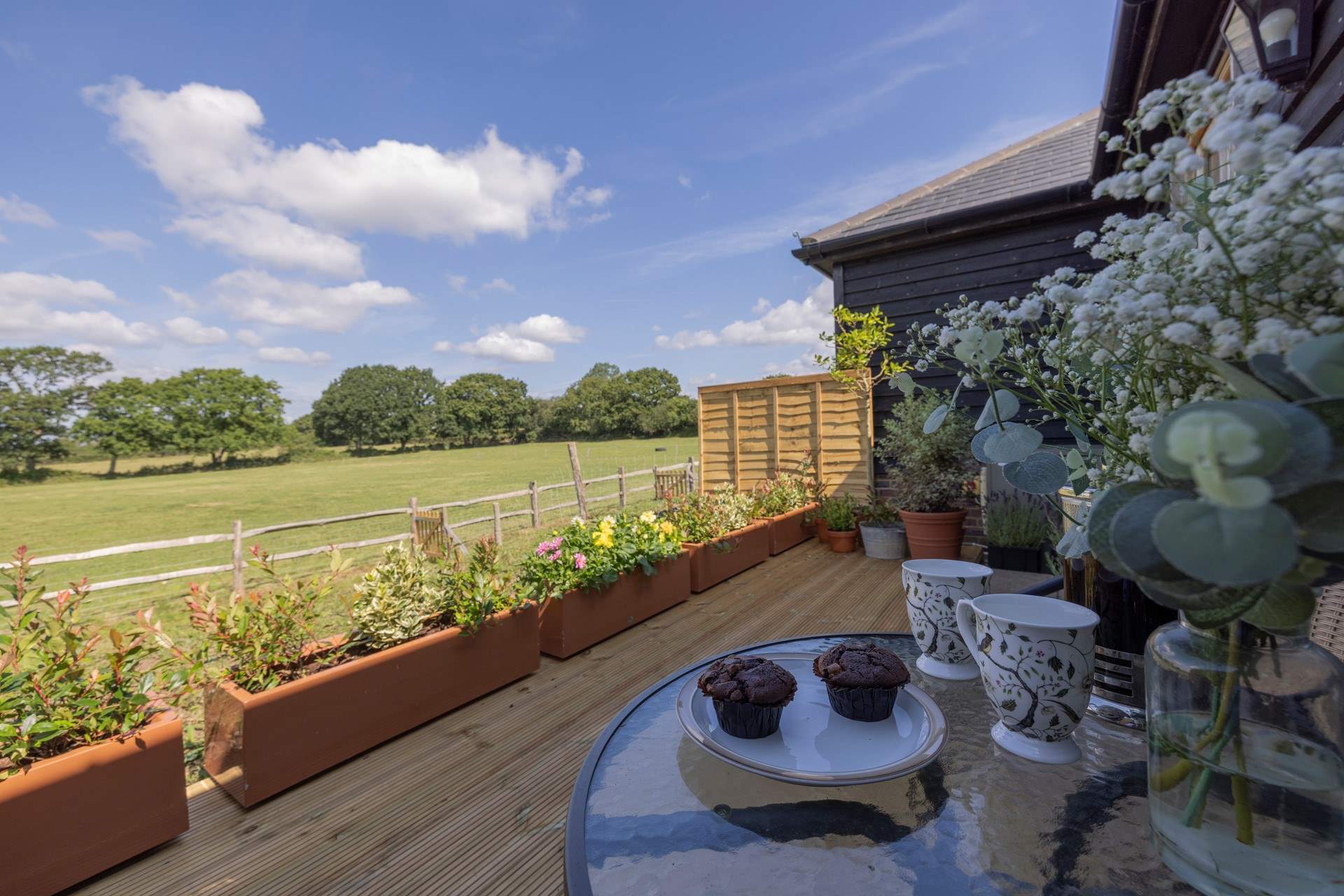 Please note there is no access beyond the planters but there is a communal lawn adjacent to the cottages.