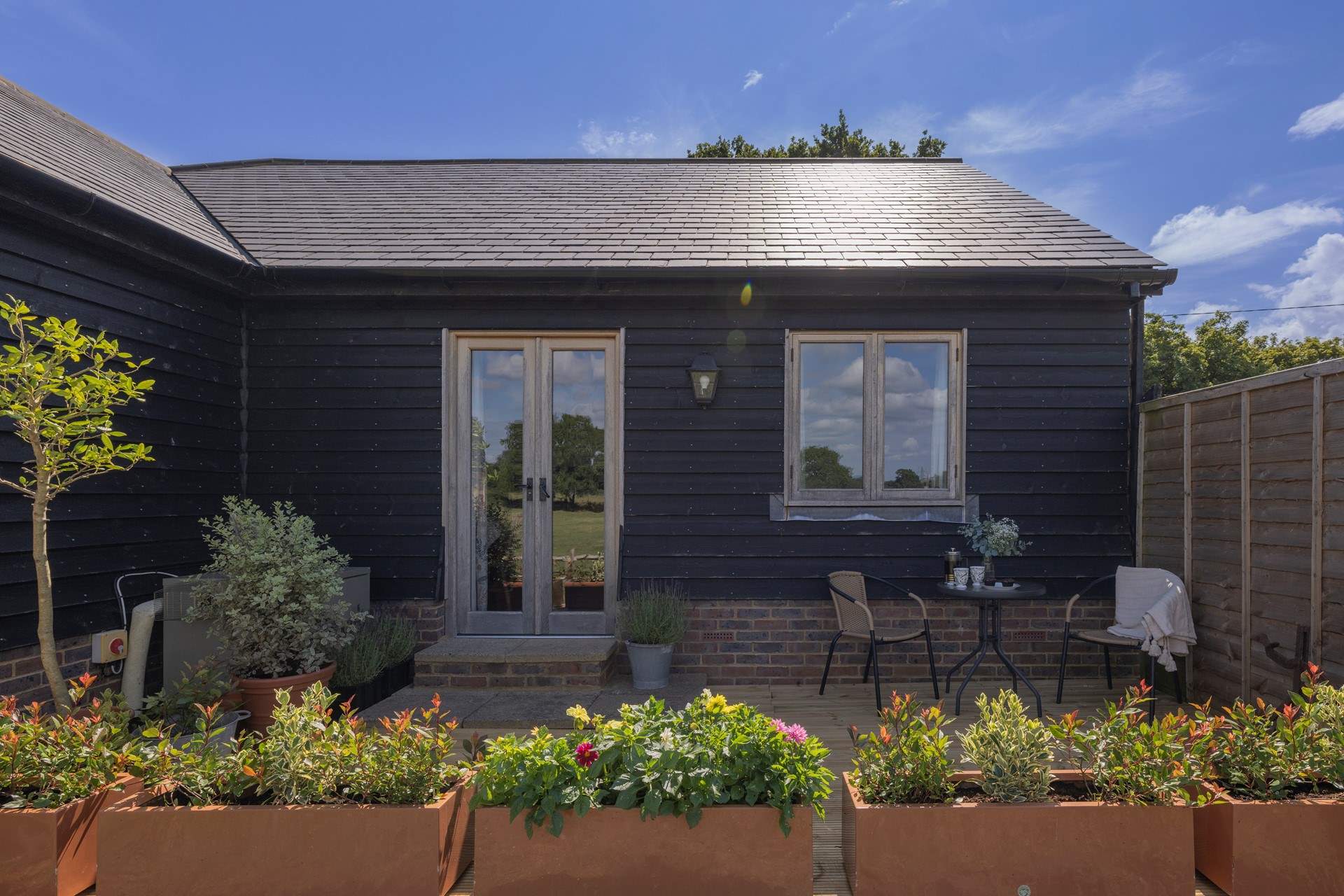 There is a small deck-area with table and chairs. The perfect spot for a morning coffee.