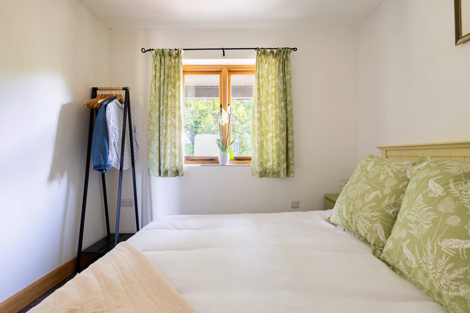 The bedroom has space to hang your clothes.