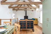 Authentic oak floorboards lay beneath, whilst beamed ceilings soar overhead.