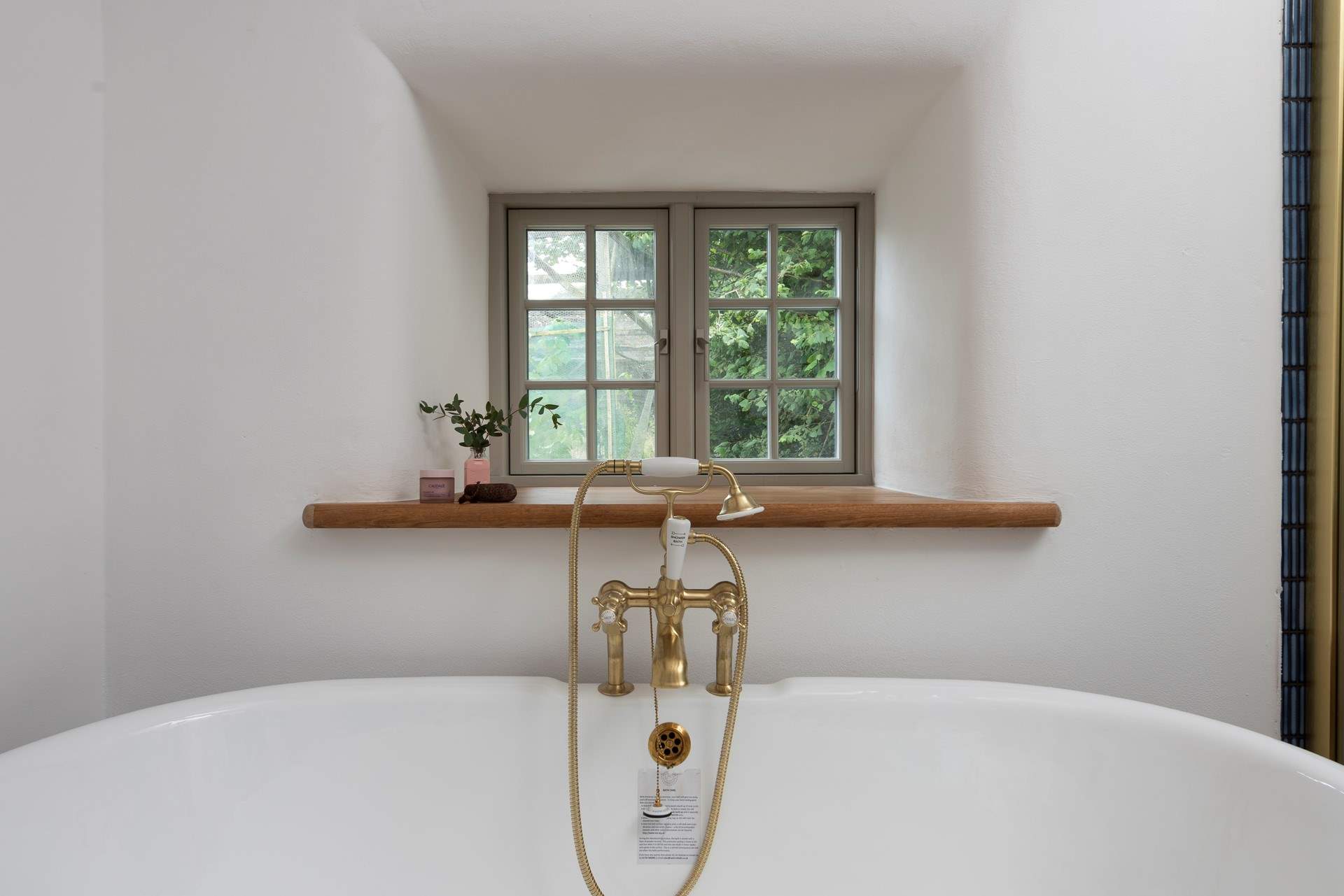 Complete with luxurious roll-top bath.