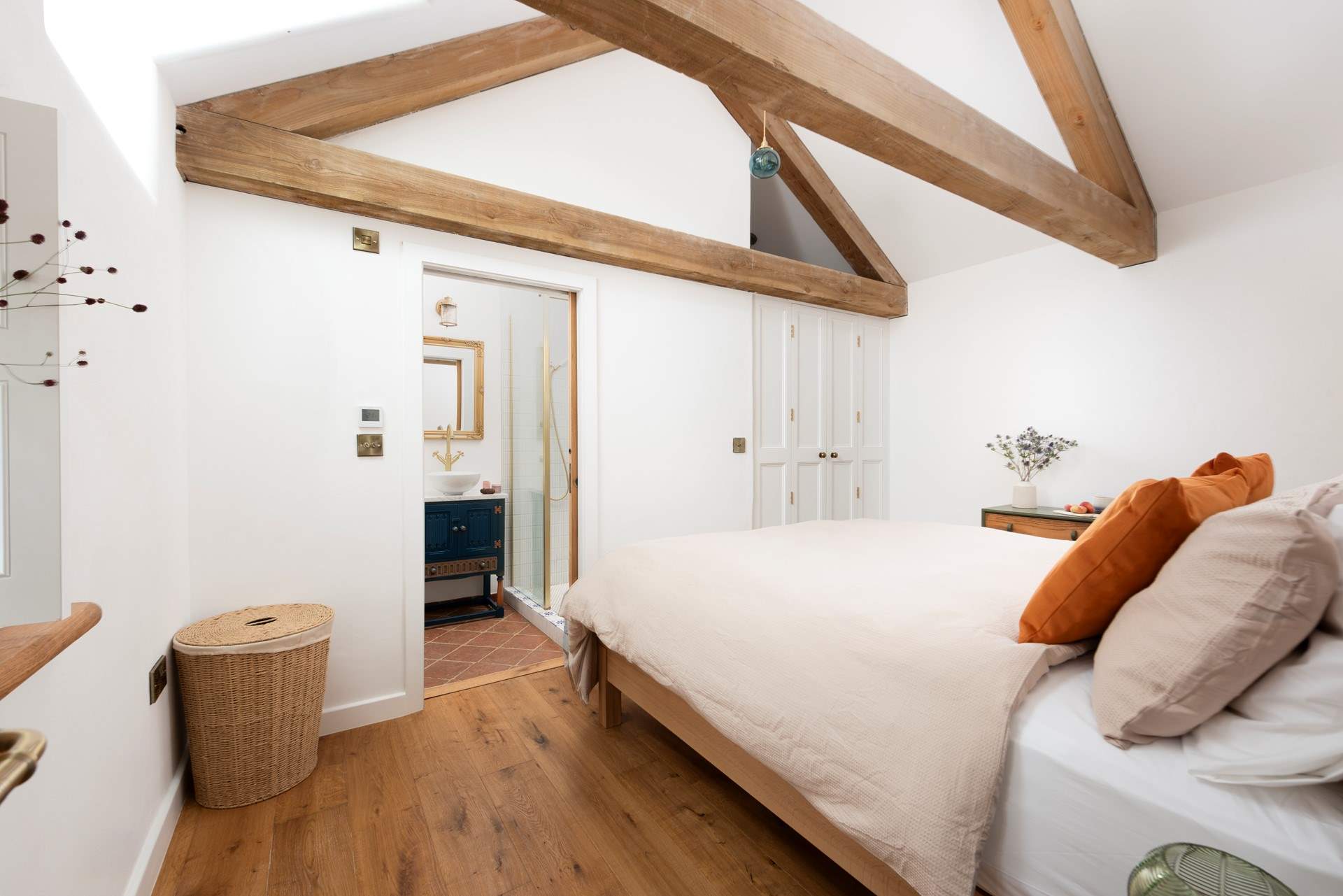 Oak floorboards complement Tuscan terracotta tiles.