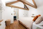 Oak floorboards complement Tuscan terracotta tiles.