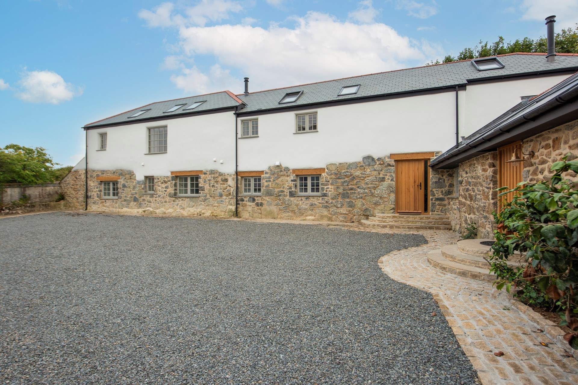Starry Skies is semi-detached to its sister property, Swallows' Nest, with three steps up to the front door. 