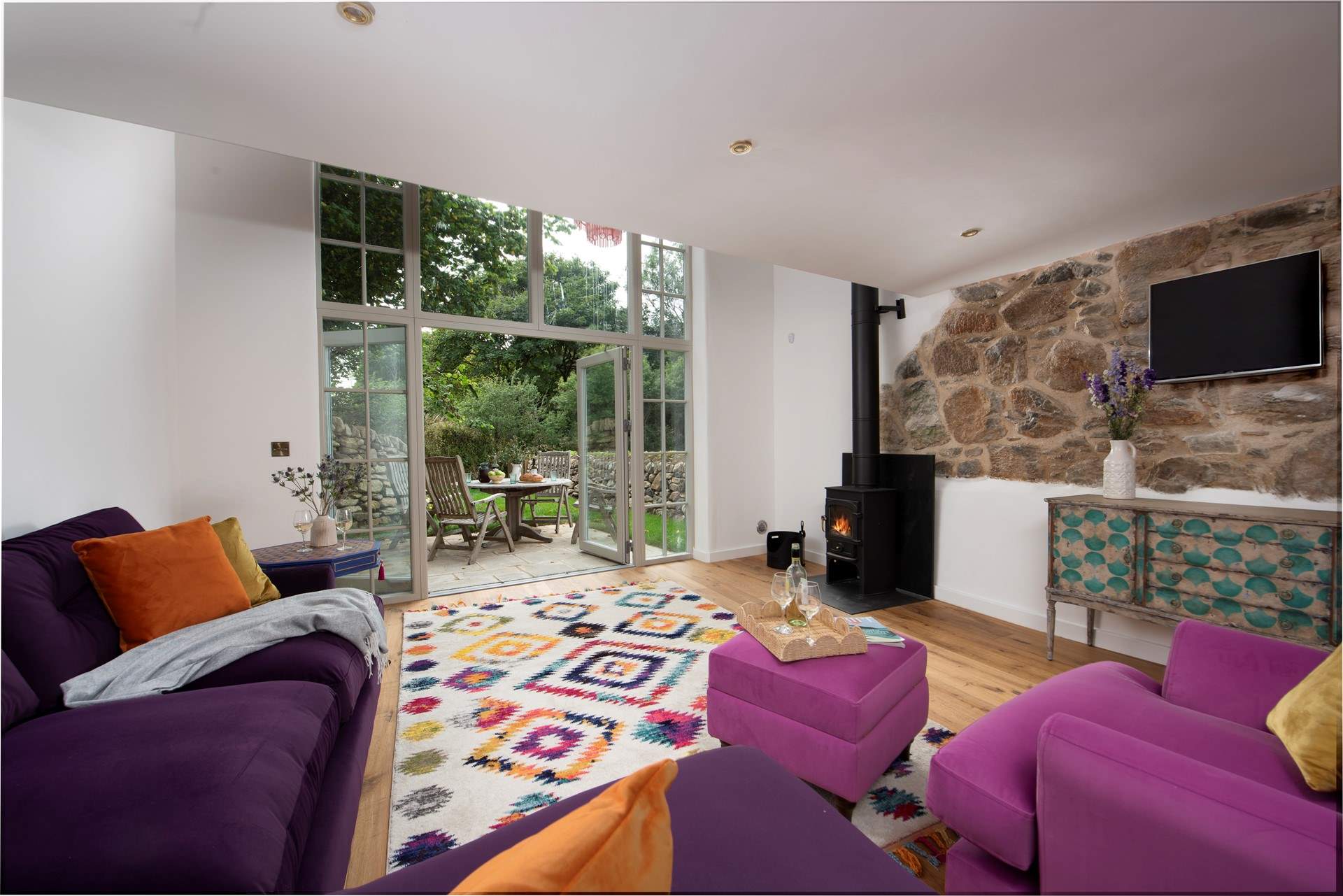The sumptuous sitting-room opens up to the paved patio.