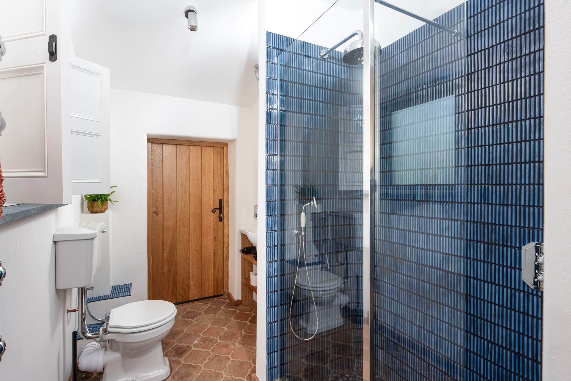 The shower-room gives a modern twist on Tuscan farmhouse.