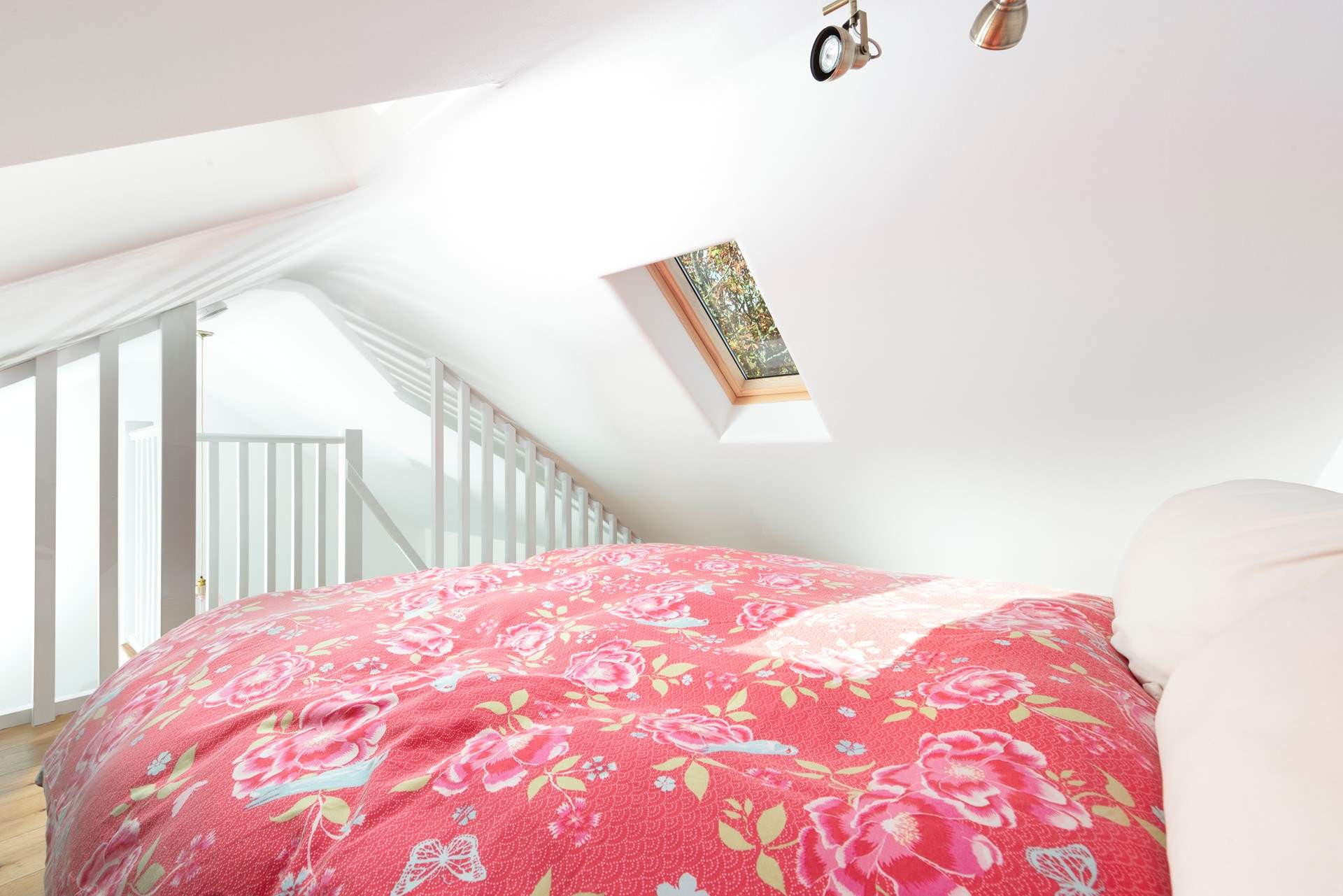 The bedroom features a mezzanine design.