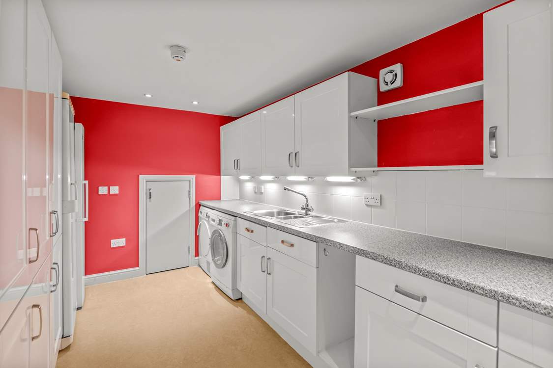 Just off the dining-area there is also this huge utility-room. Providing so much storage and a great space to store all your supplies.